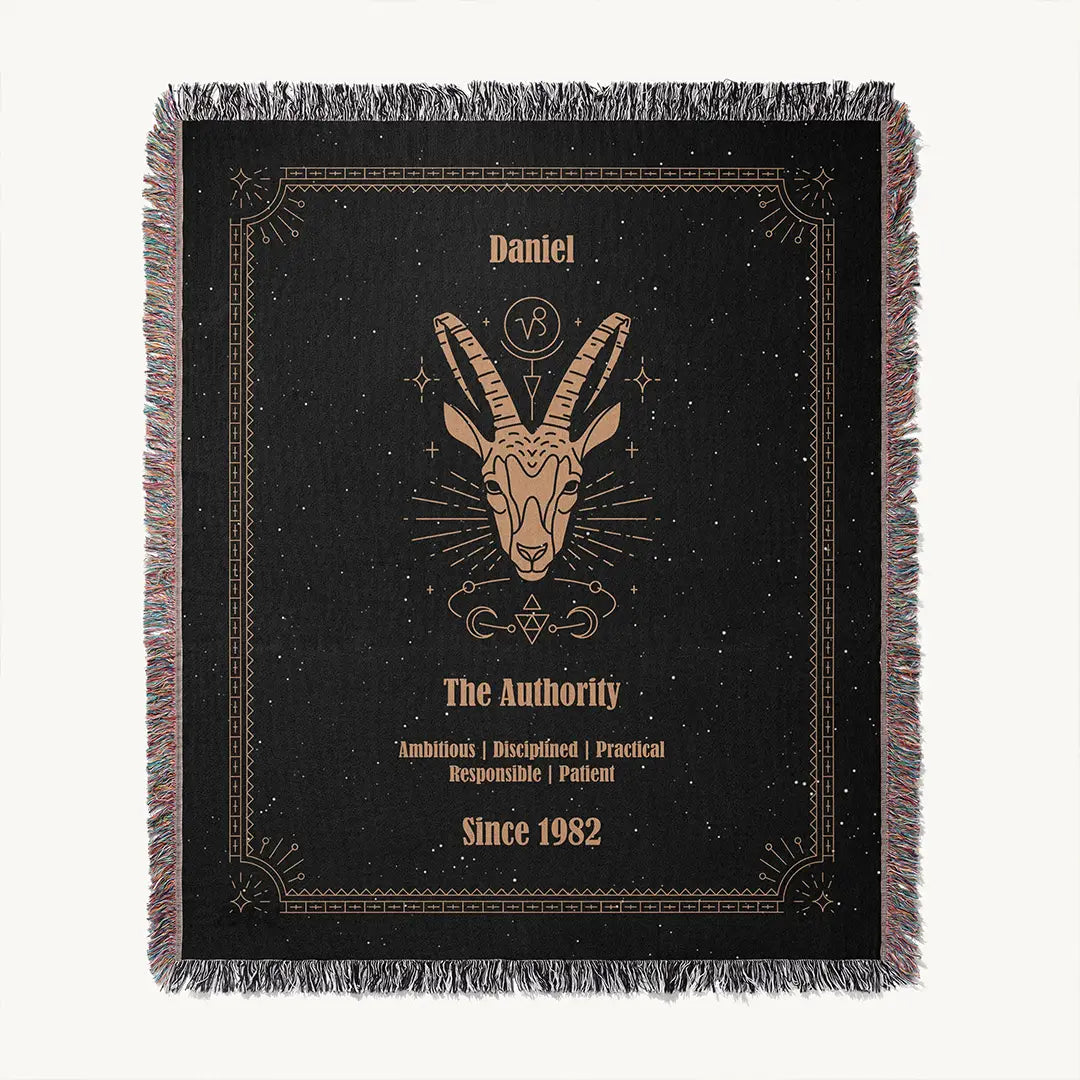 Flat lay of a Capricorn custom woven cotton blanket featuring detailed astrological elements and personal name customization.