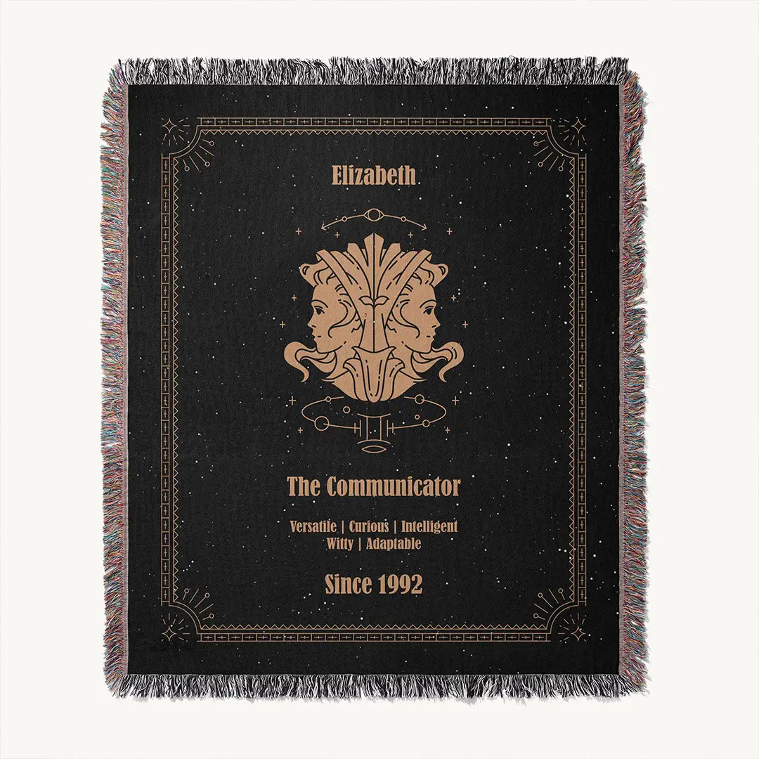Custom woven cotton blanket showing a full Gemini zodiac design and border pattern on a plain background.