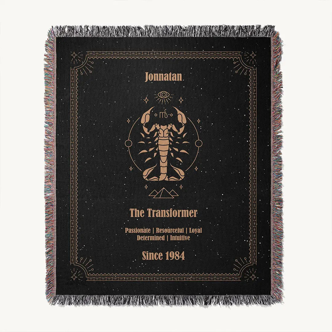 Flat lay of acustom woven cotton blanket with a Scorpio zodiac artwork centered, showcasing a custom name, and character traits.