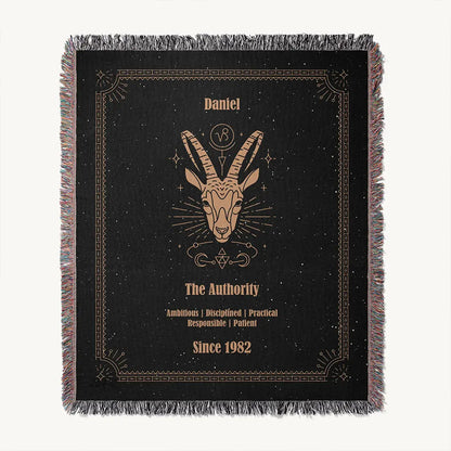 Flat lay of a Capricorn custom woven cotton blanket featuring detailed astrological elements and personal name customization.