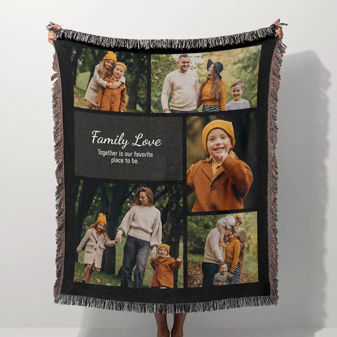 Personalized woven photo blanket with fringed edges held outdoors against a background of green trees.