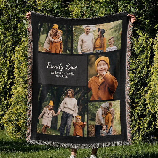 Personalized woven photo blanket with fringed edges held outdoors against a background of green trees.