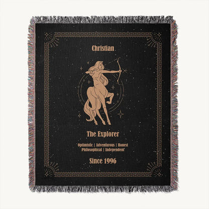 A Sagittarius-themed custom woven cotton blanket is laid flat on a white  background, revealing the full illustration and personalized details.