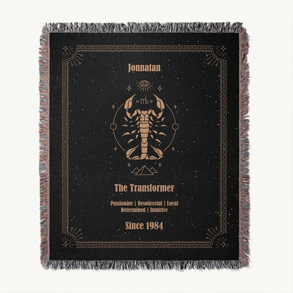 Flat lay of acustom woven cotton blanket with a Scorpio zodiac artwork centered, showcasing a custom name, and character traits.