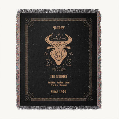 A custom woven cotton blanket with a bold Taurus zodiac illustration, shown laid flat on a white background with all details clearly visible.