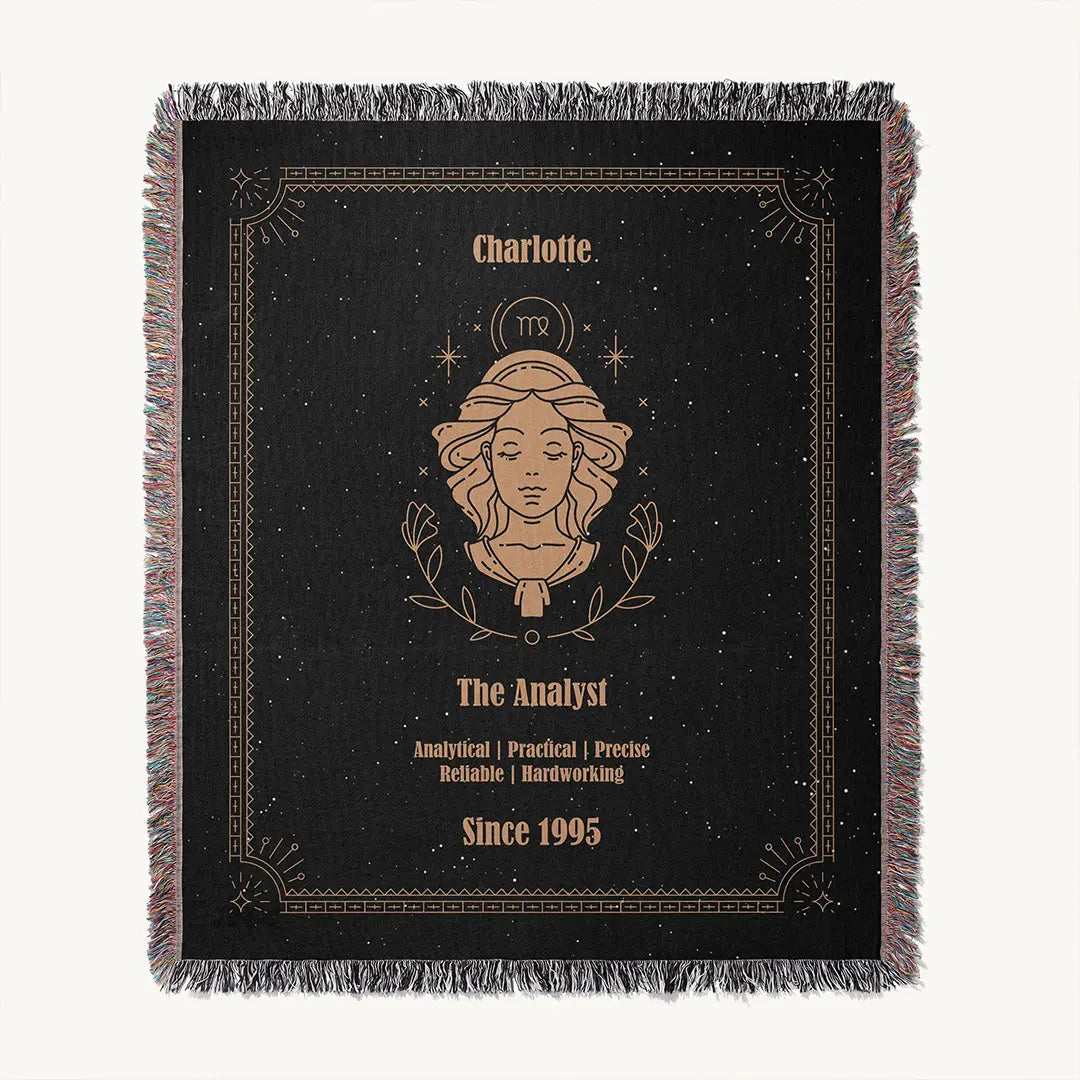 Flatlay of the Virgo zodiac custom woven cotton blanket, presenting a centered feminine illustration, a custom name, and associated traits on a black starry background.